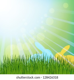 Sun rays green meadow with colored rabbits.