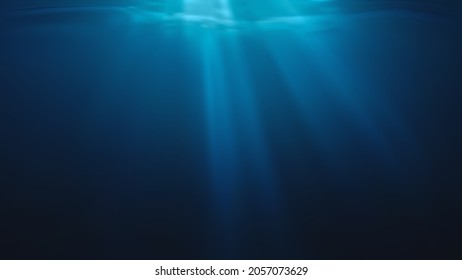 Sun rays and light shining through surface of ocean seen from underwater.