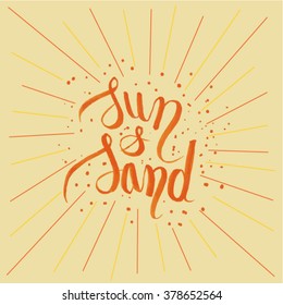 Sun & Sand written by hand with the sun color and sand color