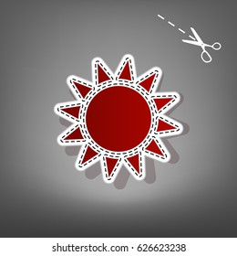 Sun sign illustration. Vector. Red icon with for applique from paper with shadow on gray background with scissors.