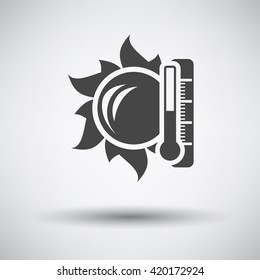 Sun and thermometer with high temperature icon on gray background with round shadow. Vector illustration.