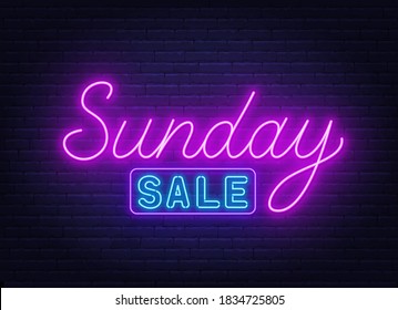 Sunday Sale neon sign on brick wall background.