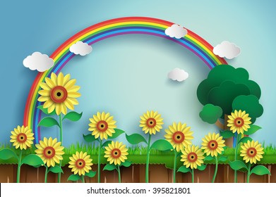 Sunflower field with blue sky and rainbow, paper art.