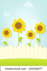 Sonnenblumen hinter Zaun