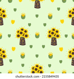 Sunflowers in vase on light green background