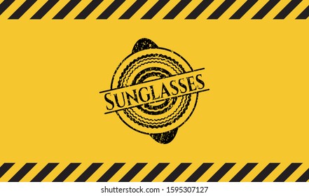 Sunglasses black grunge emblem with yellow background. Vector Illustration. Detailed.