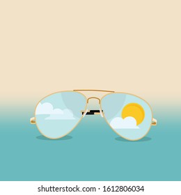 Sunglasses with blue sky, clouds and sun reflection. Summer sunglasses aviator on sea beach background