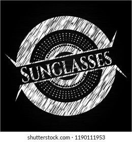 Sunglasses chalkboard emblem on black board