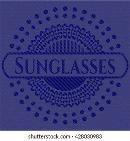 Sunglasses denim background