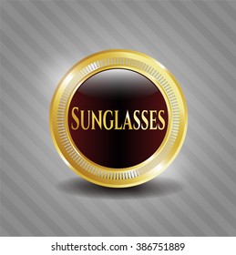 Emblema de oro de gafas de sol
