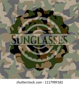 Sunglasses written on a camouflage texture