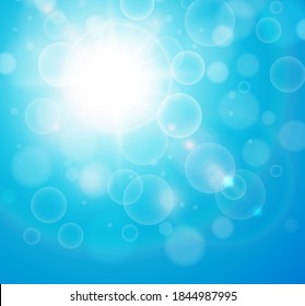 Sunny blue background, sun with bokeh, turquoise summer vector illustration.