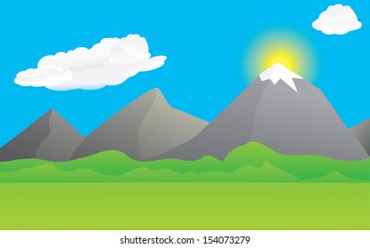 Sunny landscape with mountains and white clouds