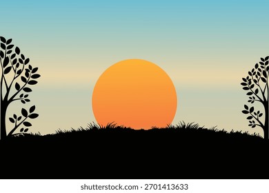 Amanecer con la silueta de los árboles de fondo