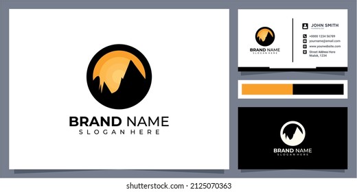 Sunset above mountains peak silhouette. Vintage styled mountain logo or sticker