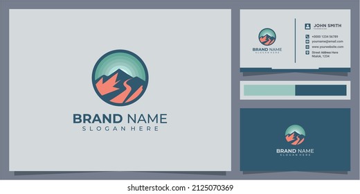 Sunset above mountains peak silhouette. Vintage styled mountain logo