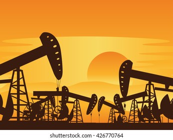 Sunset background and working oil pump silhouette.