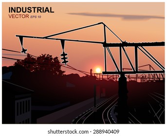 Sunset. City. Railway station. Silhouette of metallic constructions. Eps 10.