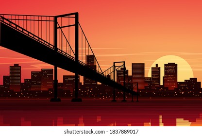 Sunset in city with suspension bridge