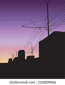Sunset cityskape with buildings and electric cables
