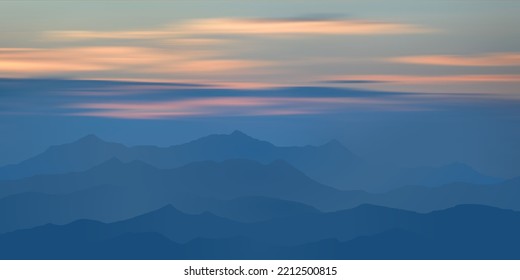 Sunset in the mountains, peaks in the haze, clouds