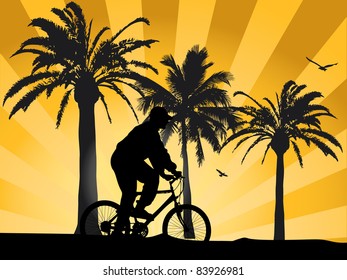 Sunset on beach with biker