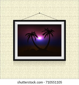 Sunset on the beach with palm trees in photo frame hanged on the wall