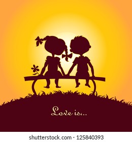 Sunset silhouettes of a boy and a girl sitting on a bench