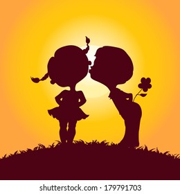 Sunset silhouettes of kissing boy and girl