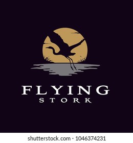 Sunset Sun with Flying Stork Heron Bird over the River Creek lake grass silhouette nature wildlife logo design 