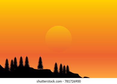 Sunset with the sun hiding in the horizon of the sea next to mountains and pine trees.