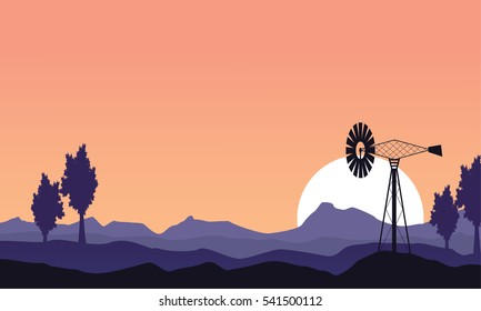 At sunset windmill silhouette scenery