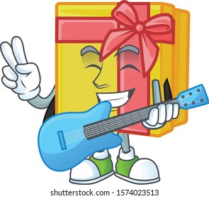 Super cool yellow gift box cartoon character performance with guitar