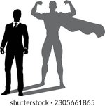 A superhero business man revealed by his shadow silhouette as a super hero in a cape