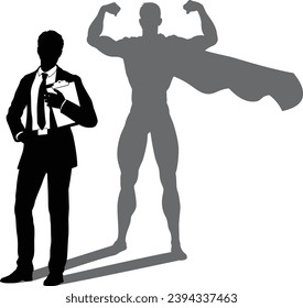 A superhero business man revealed by his shadow silhouette as a super hero in a cape