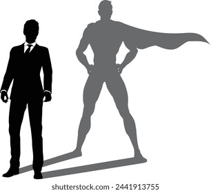 A superhero business man revealed by his shadow silhouette as a super hero in a cape