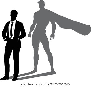 A superhero business man revealed by his shadow silhouette as a super hero in a cape