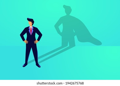 
Superhero businessman concept. Standing brave person with a cape in hes shadow. Strong leadership metaphor. Personal strength confident success growth vision