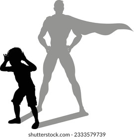 A superhero child or kid boy revealed by his shadow silhouette as a super hero in a cape.
