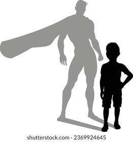 A superhero child or kid boy revealed by his shadow silhouette as a super hero in a cape.