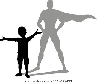 A superhero child or kid boy revealed by his shadow silhouette as a super hero in a cape.
