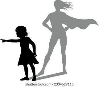 A superhero child or kid girl revealed by her shadow silhouette as a super hero in a cape.