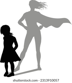 A superhero child or kid girl revealed by her shadow silhouette as a super hero in a cape.