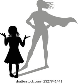 A superhero child or kid girl revealed by her shadow silhouette as a super hero in a cape.