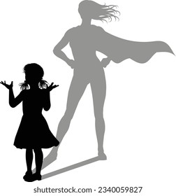A superhero child or kid girl revealed by her shadow silhouette as a super hero in a cape.