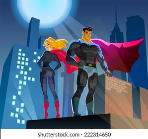 Superhero Couple: Male and female superheroes on a skyscraper roof with night city background
