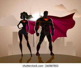 Superhero Couple: Male And Female Superheroes, Posing In Front Of A Light. City Background.