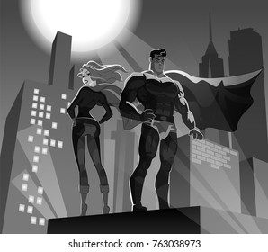 Superhero Couple: Male and female superheroes on a skyscraper roof with night city background