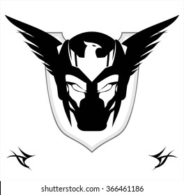 Superhero Head. Winged Black Mask over the shield. Biker. Superhero. Villain. Artwork. Warrior Mascot. Warrior head. Suitable for team identity, game icon, emblem, mascot, apparel, biker community,etc