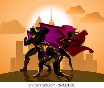 Superhero Team; Team of superheroes, posing in front of a light.